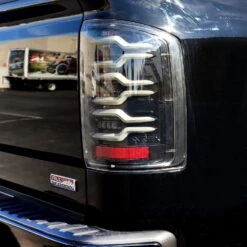 14-18 GMC Sierra 1500/2500HD/3500HD LUXX-Series LED Tail Lights Black -Car Light Shop 14 18 gmc sierra 15002500hd3500hd luxx series led tail lights black 861065